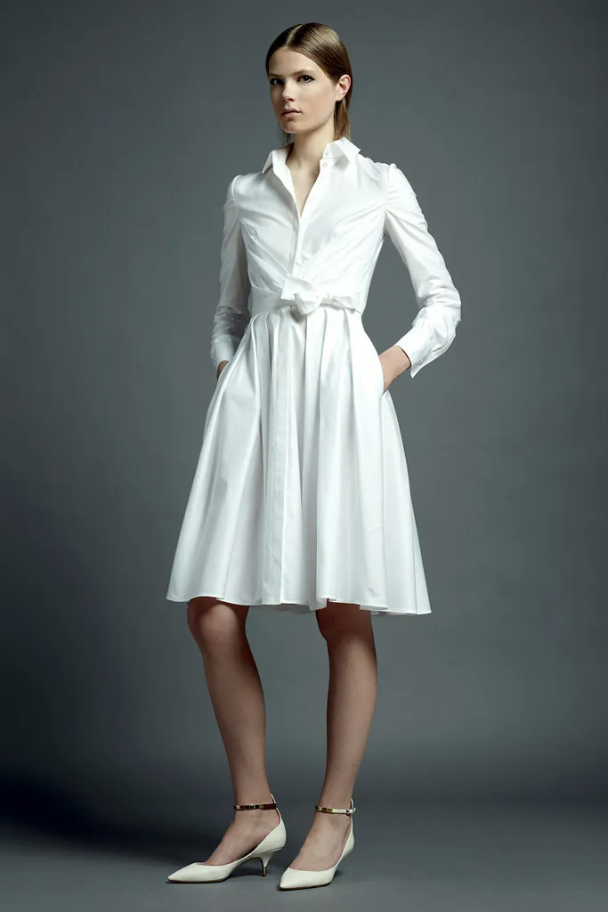 Woman wearing a white silk shirtdress